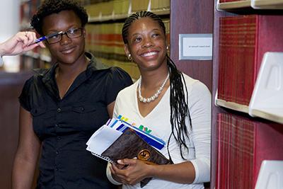 Students smile in library