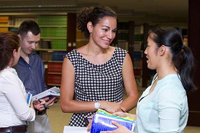 Dean Gina Bianco talks with a student